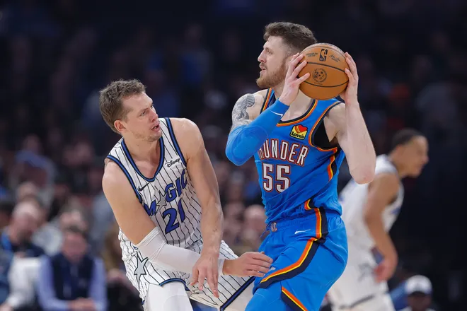 Feb 3, 2026; Oklahoma City, Oklahoma, USA; Oklahoma City Thunder center/forward Isaiah Hartenstein (55) moves the ball as Orlando Magic forward/center Moritz Wagner (21) defends during the second quarter at Paycom Center. Mandatory Credit: Alonzo Adams-Imagn Images