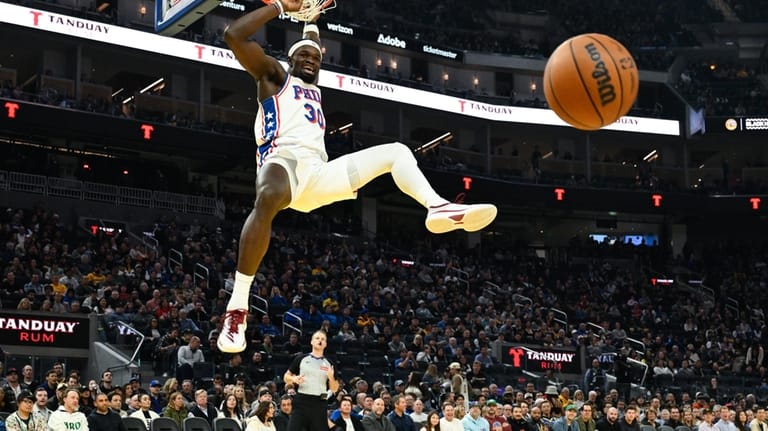 Philadelphia 76ers center Adem Bona dunks against the Golden State...