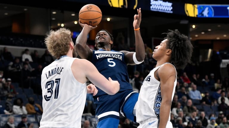 Minnesota Timberwolves guard Anthony Edwards (5) shoots against Memphis Grizzlies...