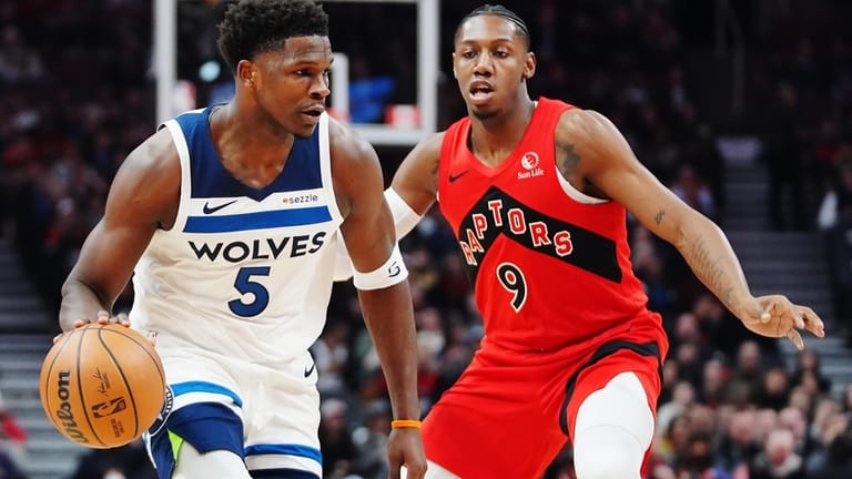 Minnesota Timberwolves' Anthony Edwards (5) protects the ball from Toronto...