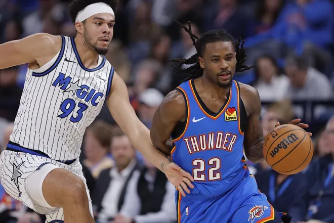 Feb 3, 2026; Oklahoma City, Oklahoma, USA; Orlando Magic guard/forward Noah Penda (93) defends a drive by Oklahoma City Thunder guard Shai Gilgeous-Alexander (2) during the second half at Paycom Center.