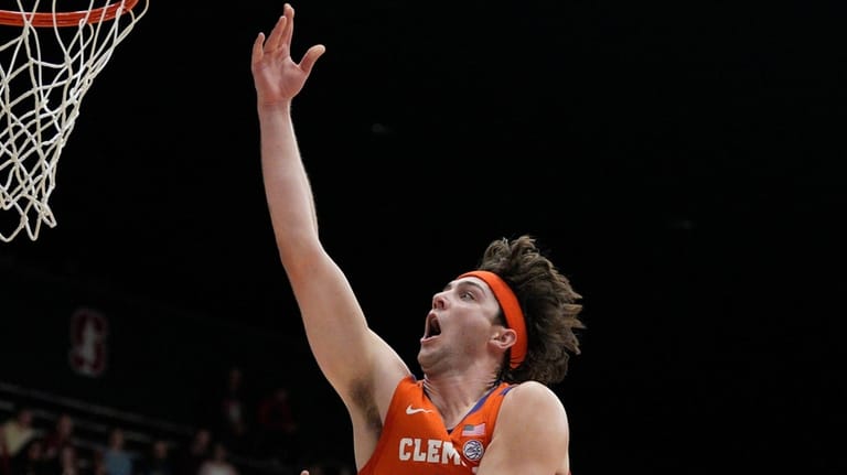 Clemson center Carter Welling (22) drives to the basket againstStanford...