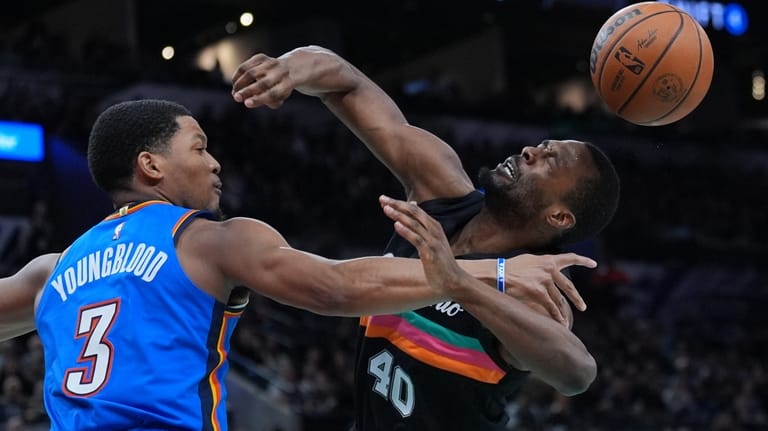 San Antonio Spurs forward Harrison Barnes (40) is fouled by...