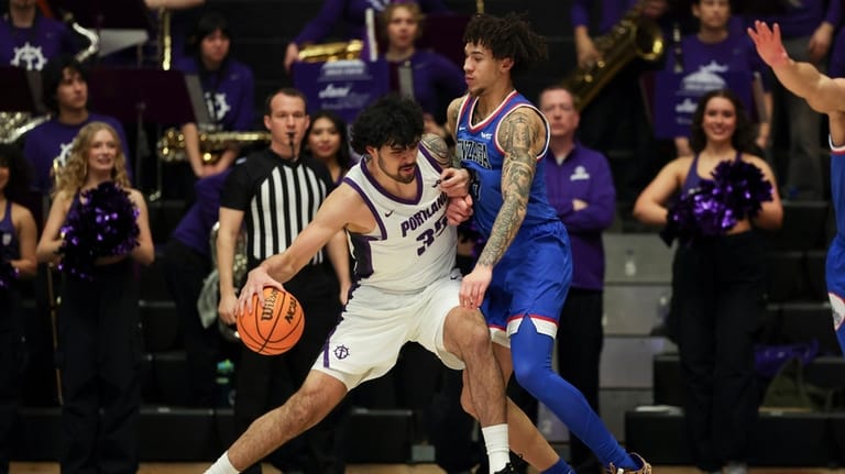 Portland forward Cameron Williams (35) drives to the basket as...