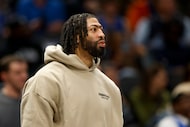 Dallas Mavericks forward Anthony Davis stands on the court during a stoppage in play during...