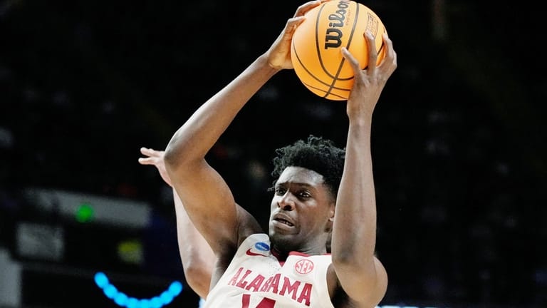 Alabama center Charles Bediako (14) pulls down a rebound while...
