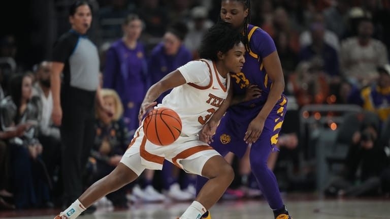 Texas guard Rori Harmon (3) drives against LSU guard Milaysia...
