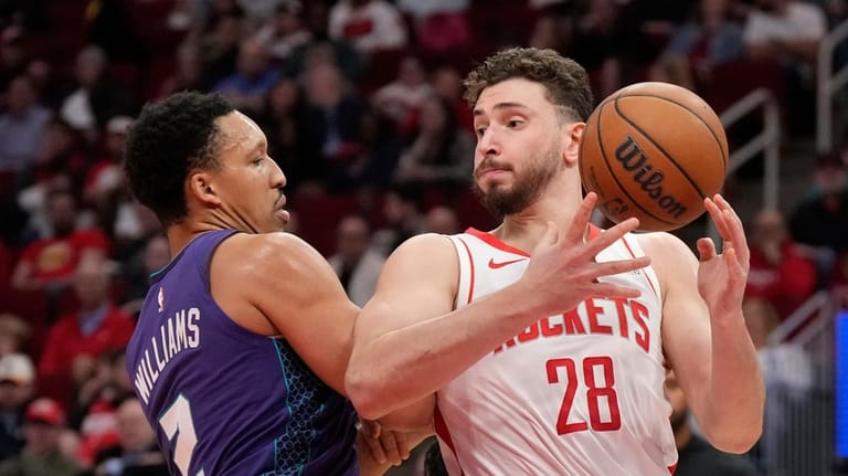 Houston Rockets center Alperen Sengun (28) tries to control the...