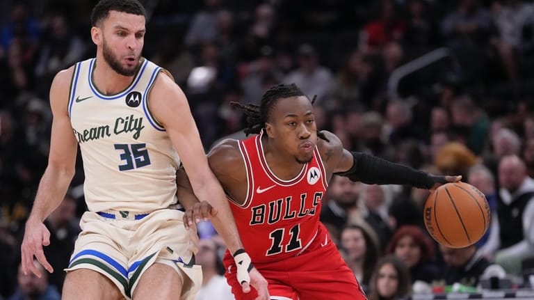 Chicago Bulls' Ayo Dosunmu gets past Milwaukee Bucks' Pete Nance...
