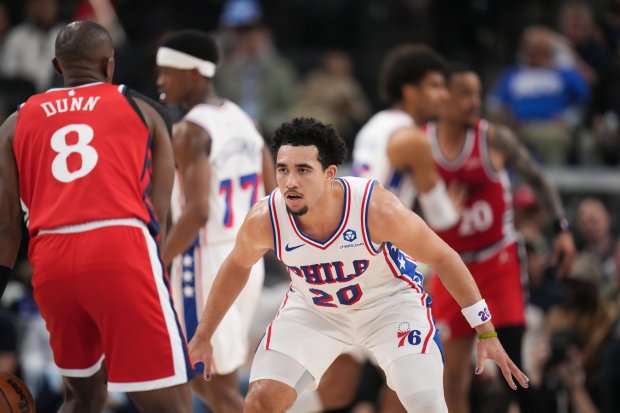 76ers guard Jared McCain (20) defends Los Angeles Clippers guard Kris Dunn (8) during the first half of a game Monday, Feb. 2, 2026, in Inglewood, Calif. (AP Photo/Jae C. Hong)
