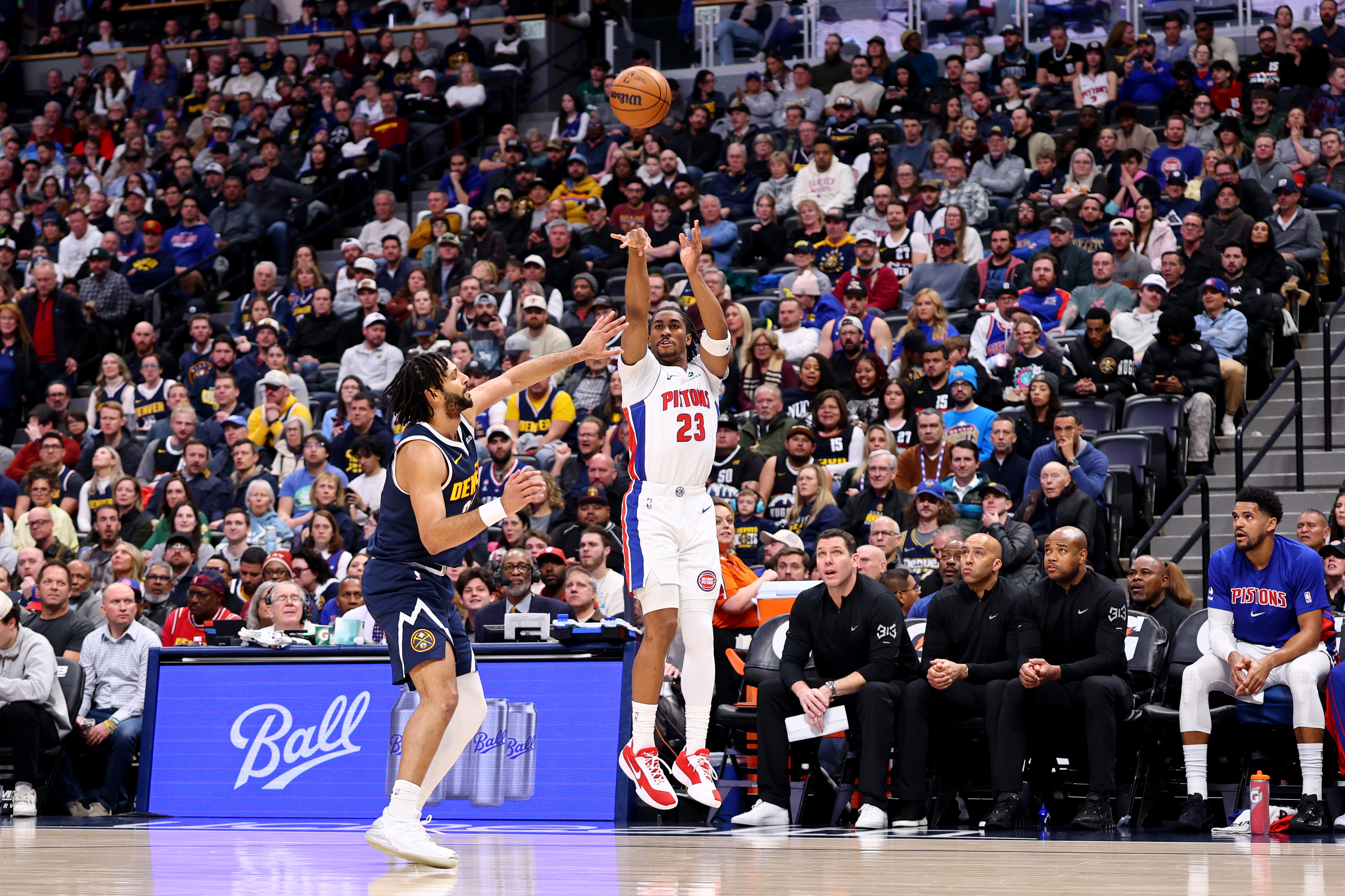 Pistons' Jaden Ivey shoots over the Nuggets' Jamal Murray in...