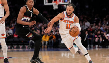 New York Knicks guard Jalen Brunson (11) drives past Denver Nuggets guard Peyton Watson (8) during the second half of an NBA basketball game, Wednesday, Feb. 4, 2026, in New York. (AP Photo/Yuki Iwamura)