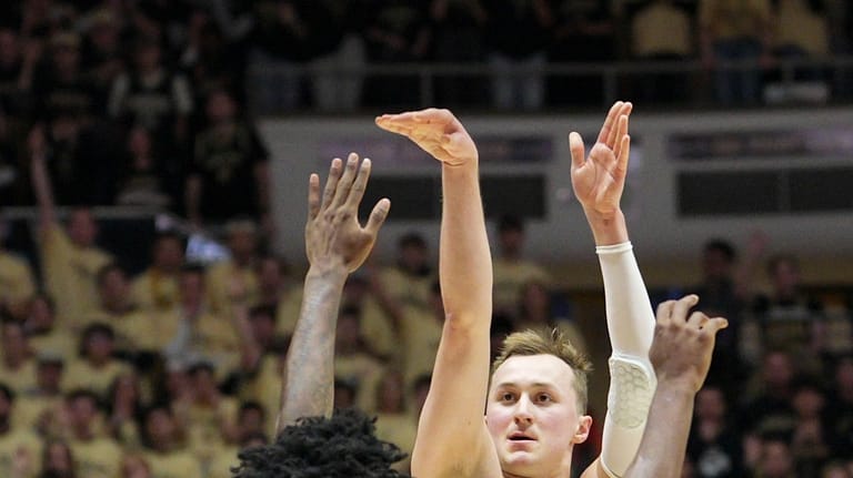 Purdue guard Fletcher Loyer (2) shots over Oregon guard Takai...