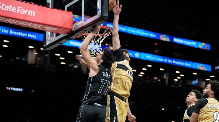 Brooklyn Nets guard Ben Saraf (77) is blocked by Washington...