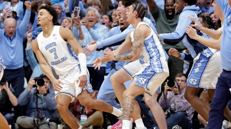 North Carolina guard Seth Trimble (7) celebrates with teammates and...