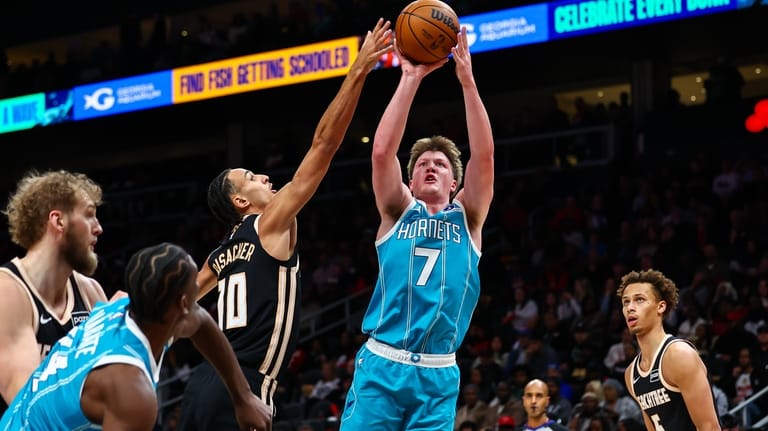 Charlotte Hornets guard Kon Knueppel (7) looks to shoot against...
