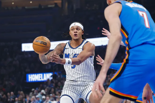 Feb 3, 2026; Oklahoma City, Oklahoma, USA; Orlando Magic forward Paolo Banchero (5) passes against the Oklahoma City Thunder during the first quarter at Paycom Center. Mandatory Credit: Alonzo Adams-Imagn Images