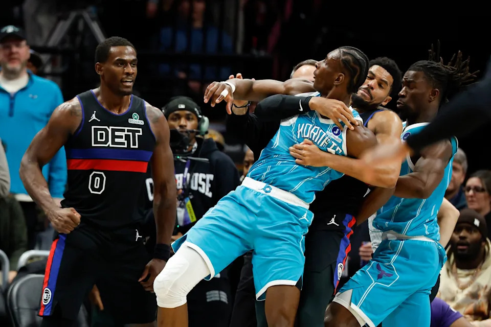 Charlotte Hornets forward Moussa Diabate, second from left, is held back as he goes and Detroit Pistons center Jalen Duren (0) fight during the second half of an NBA basketball game in Charlotte, N.C., Monday, Feb. 9, 2026. (AP Photo/Nell Redmond)