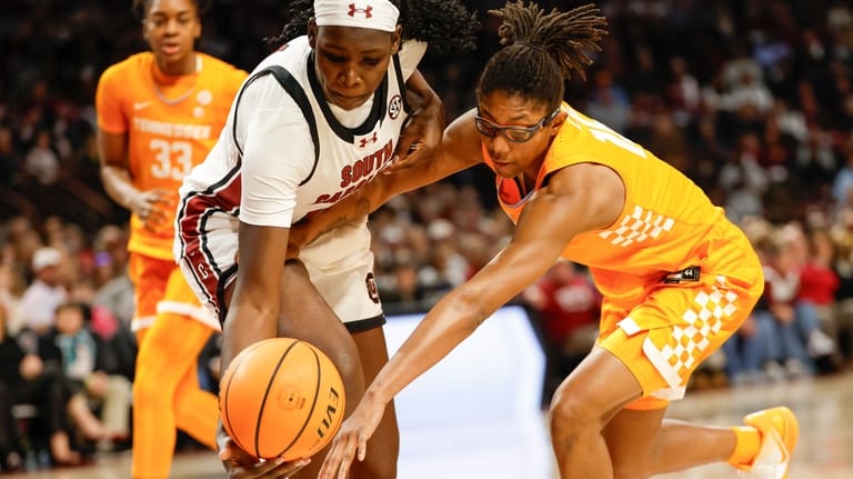 South Carolina center Madina Okot, left, and Tennessee guard Jaida...