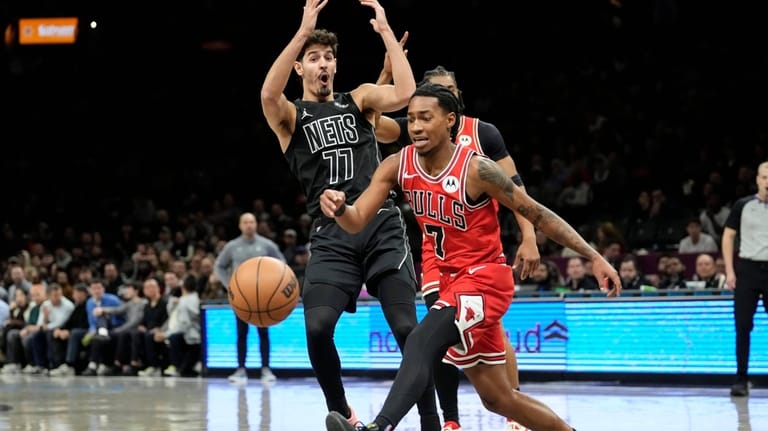 Brooklyn Nets guard Ben Saraf (77) reacts as he gets...