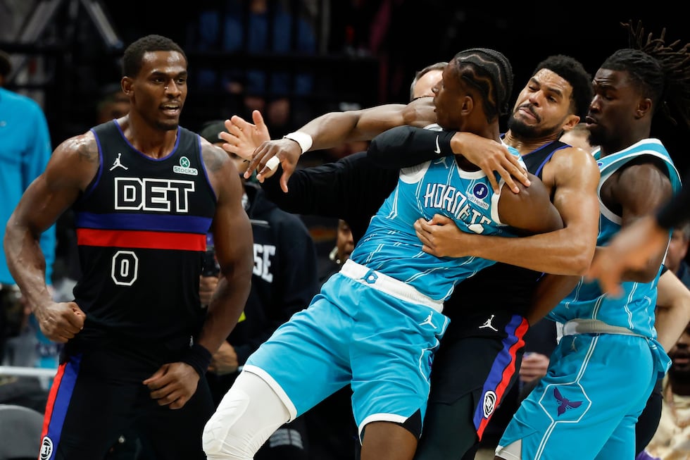 Charlotte Hornets forward Moussa Diabate, front right, is held back as he fights with Detroit...