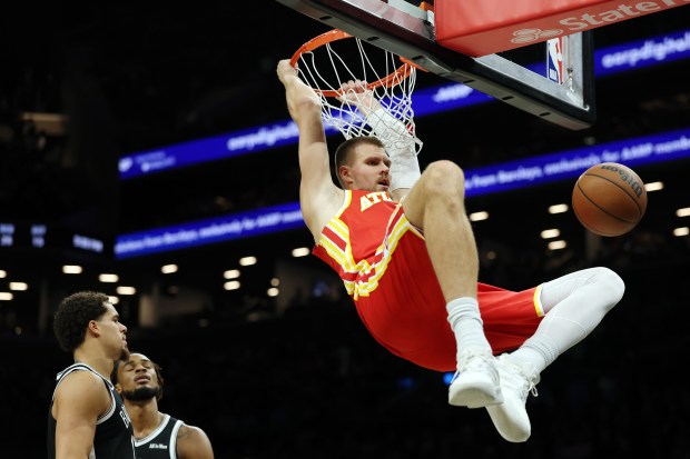 NEW YORK, NEW YORK - OCTOBER 29: Kristaps Porzingis #8 of the Atlanta Hawks dunks the ball during the second half against the Brooklyn Nets at Barclays Center on October 29, 2025 in New York City. The Hawks won 117-112. NOTE TO USER: User expressly acknowledges and agrees that, by downloading and or using this photograph, User is consenting to the terms and conditions of the Getty Images License Agreement. (Photo by Sarah Stier/Getty Images)