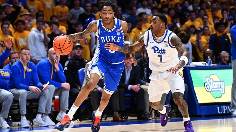 Duke's Isaiah Evans dribbles as Pittsburgh's Damarco Minor (7) defends...