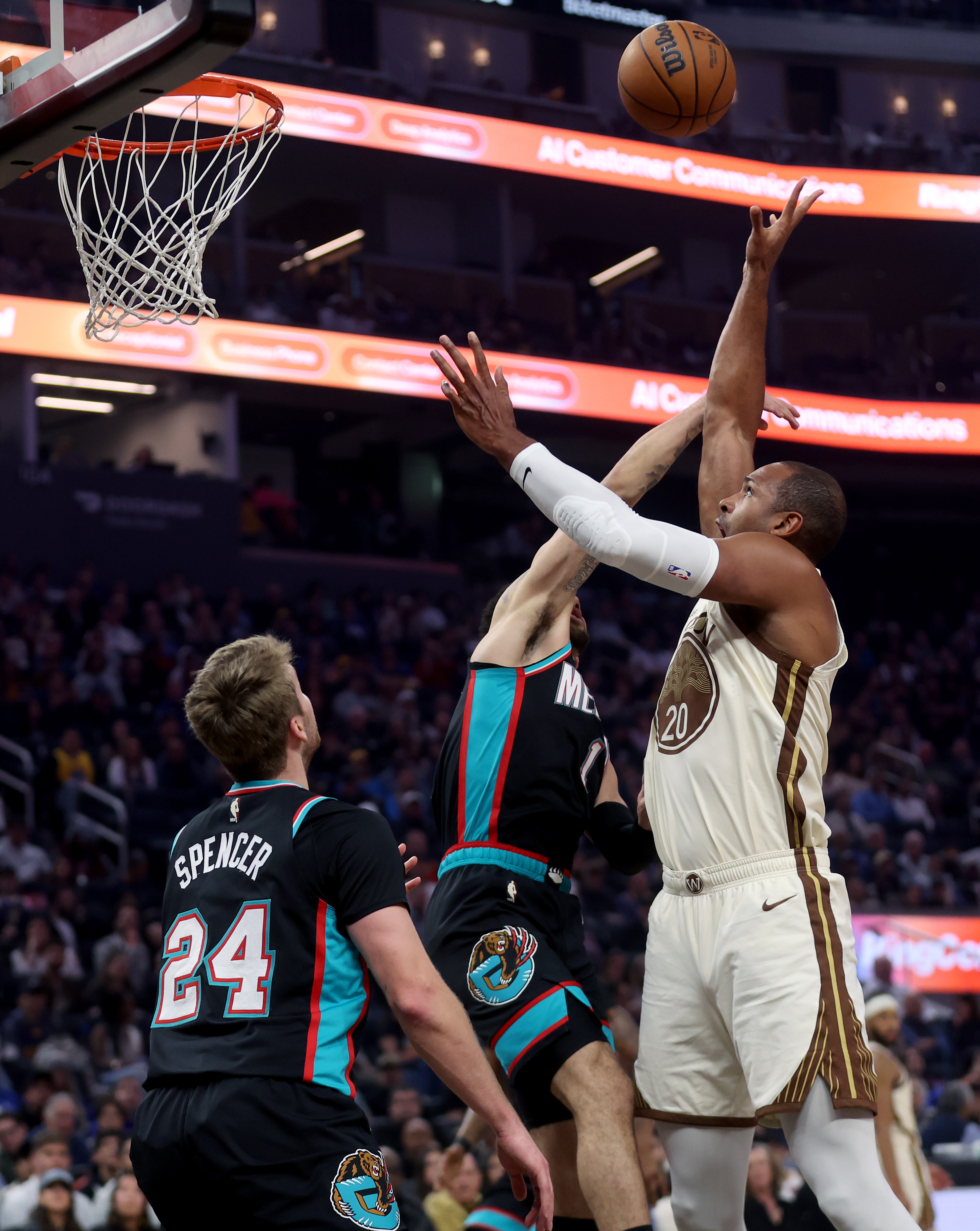 Golden State Warriors’ Al Horford #20 is fouled by Memphis...