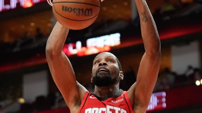 Houston Rockets forward Kevin Durant dunks against the Los Angeles...
