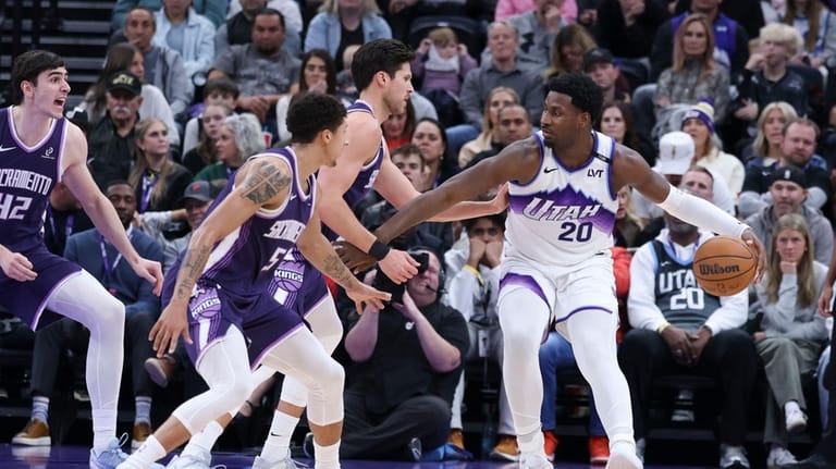 Utah Jazz forward Jaren Jackson Jr. (20) posts up against...
