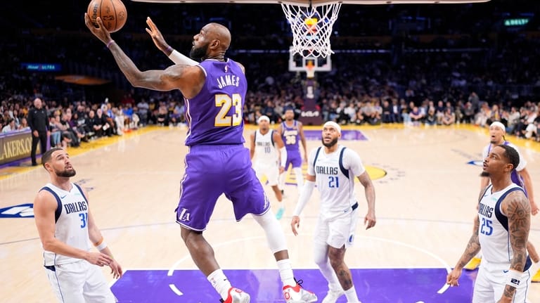 Los Angeles Lakers forward LeBron James (23) shoots as Dallas...