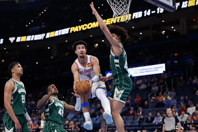 Feb 12, 2026; Oklahoma City, Oklahoma, USA; Oklahoma City Thunder guard Jared McCain (3) goes up for a basket as Milwaukee Bucks guard Andre Jackson Jr. (44) defends during the second half at Paycom Center. Mandatory Credit: Alonzo Adams-Imagn Images