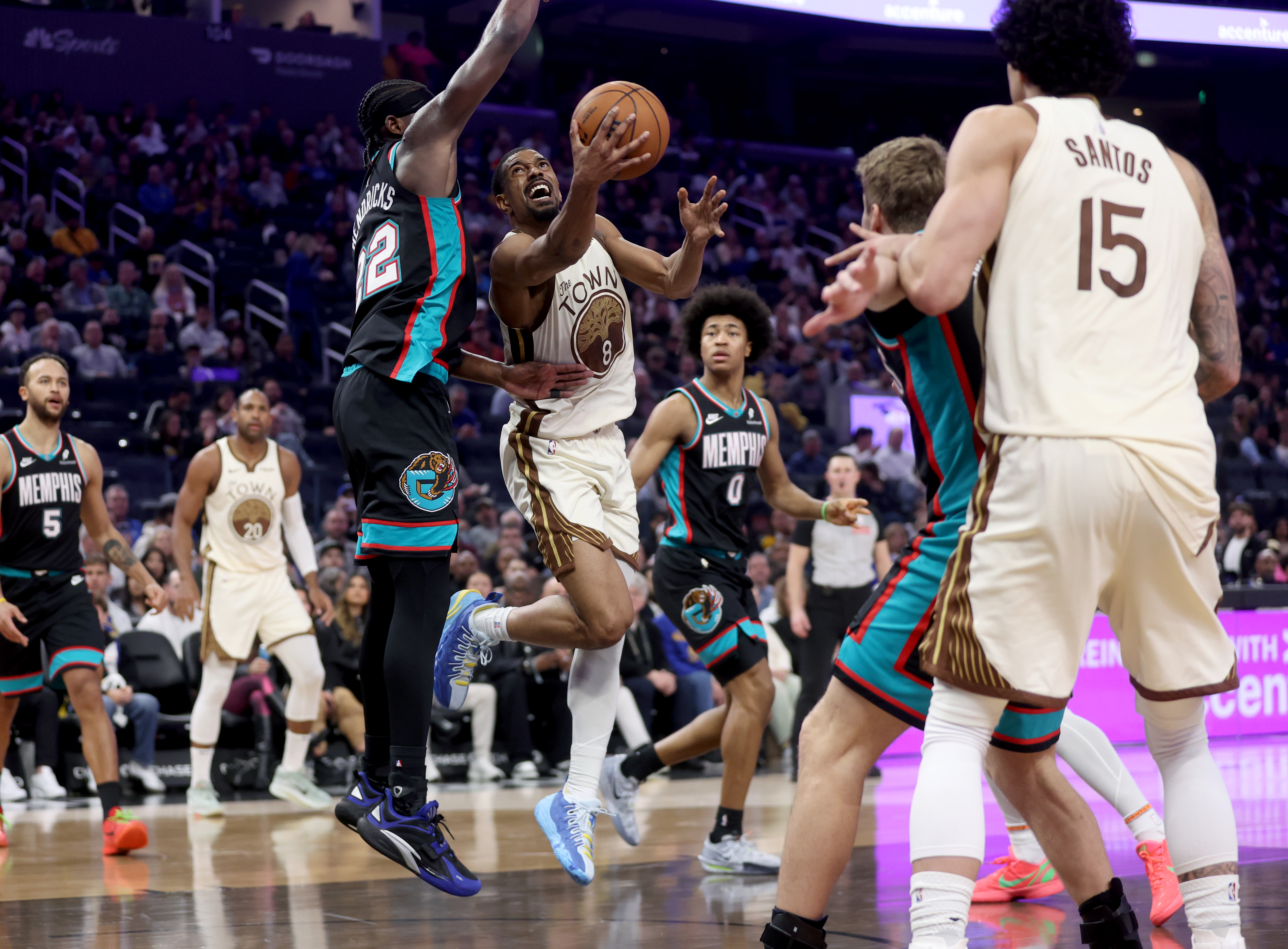 Golden State Warriors' De'anthony Melton #8 drives to the basket...