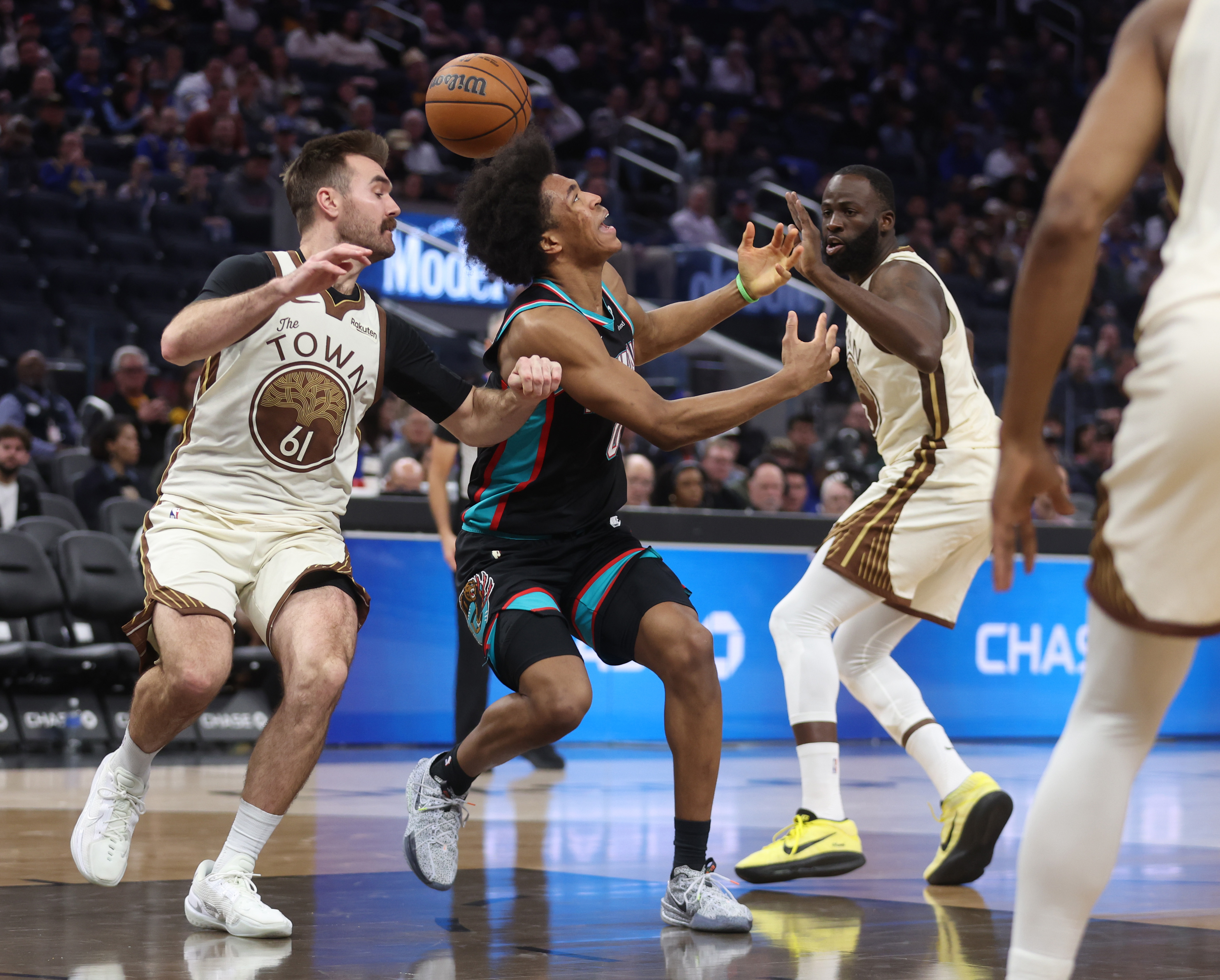 Memphis Grizzlies' Jaylen Wells #0 loses control of the ball...