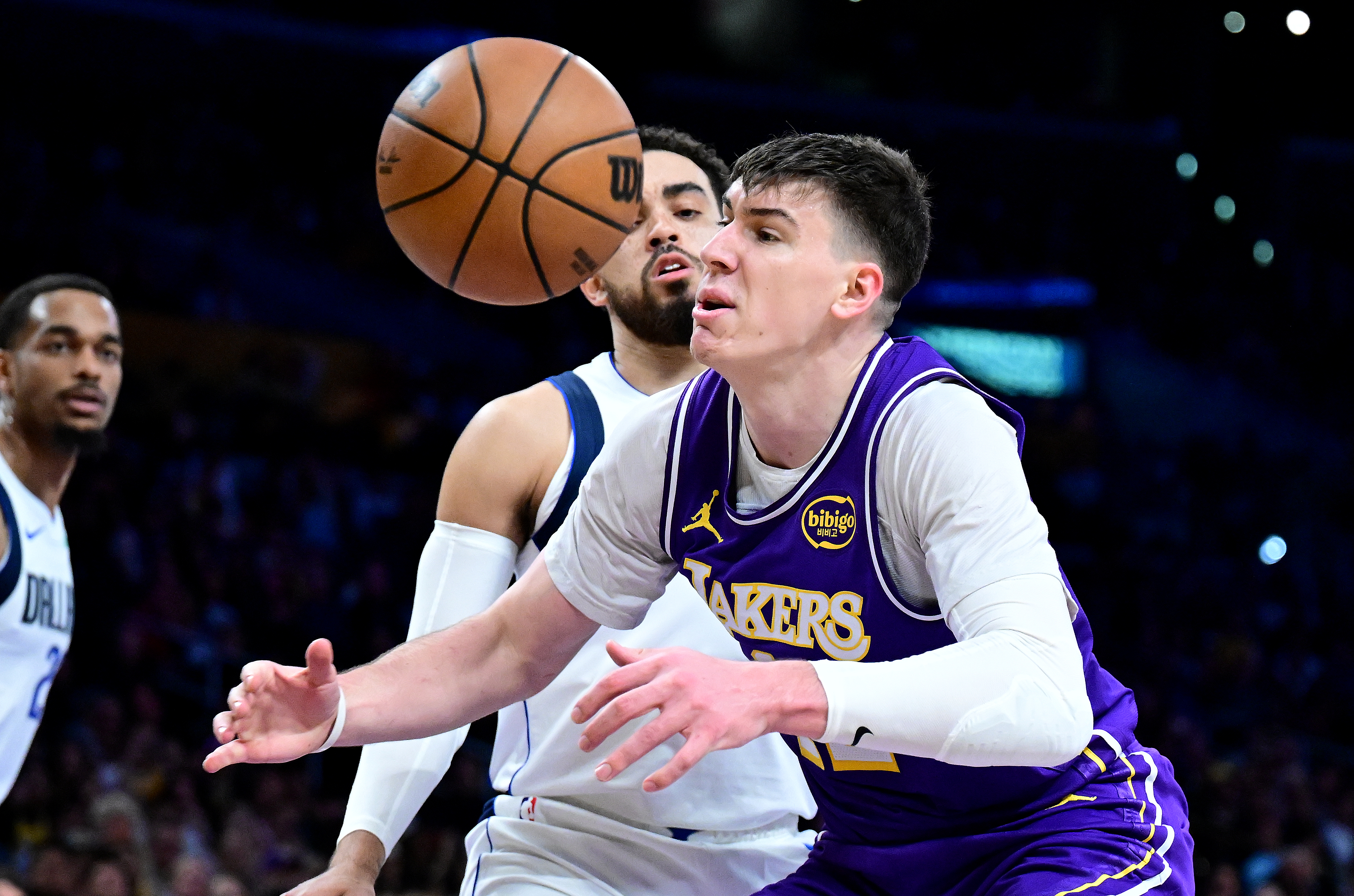 Lakers forward Jake LaRavia has the ball knocked away by...