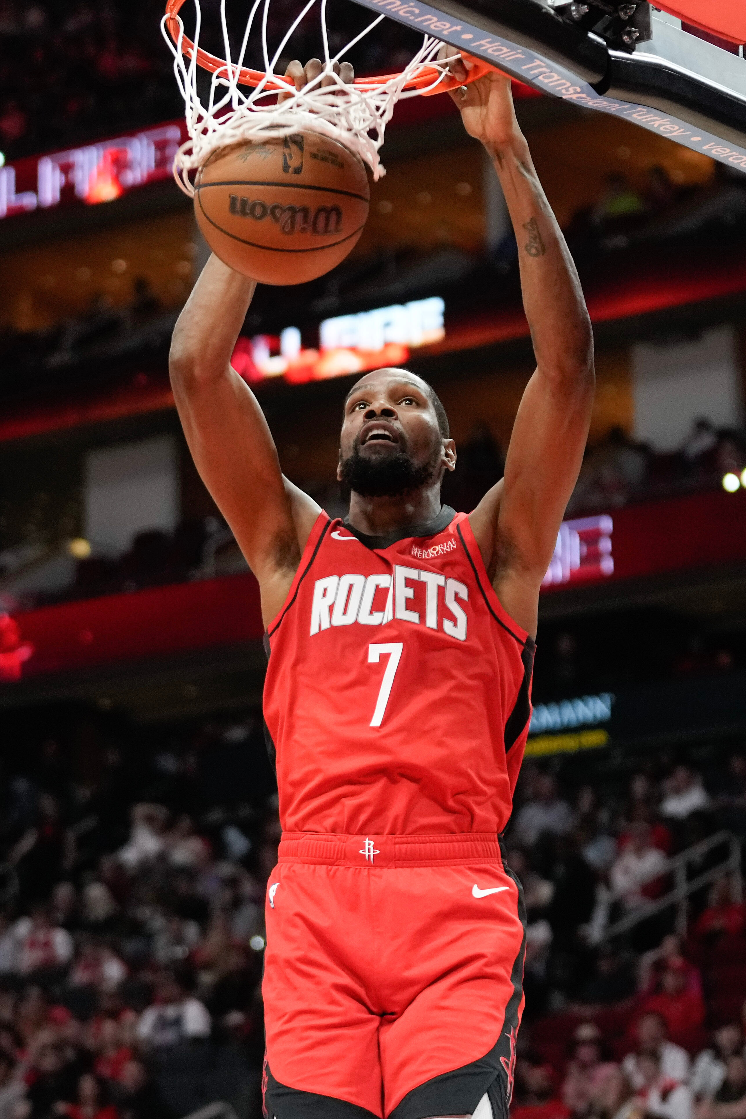 Houston Rockets forward Kevin Durant dunks during the first half...