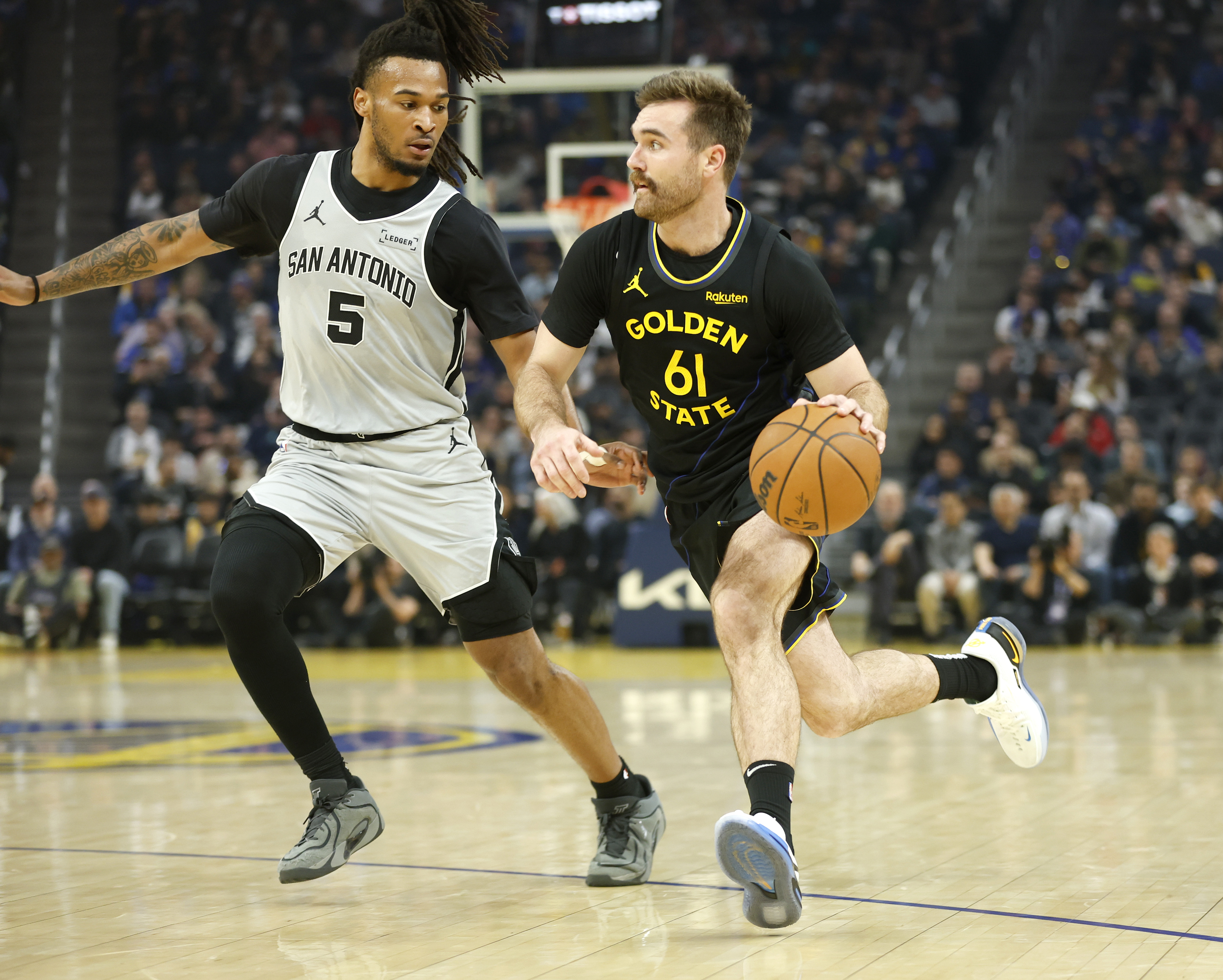 Golden State Warriors' Pat Spencer (61) heads to the basket...