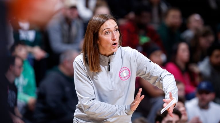 Michigan State coach Robyn Fralick gives instructions during the second...