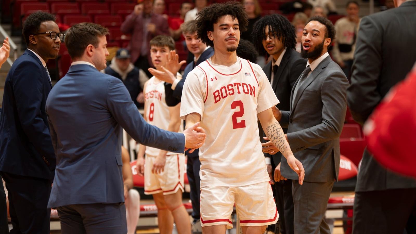 Otto Landrum and Ben Roy gather with head coach Joe Jones and family for a pregame Senior Day photo