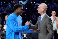 USA Stars guard Anthony Edwards, left, shakes hands with commissioner Adam Silver after the...