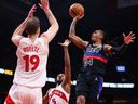 Daniss Jenkins #24 of the Detroit Pistons drives to the net against Jakob Poeltl #19 of the Toronto Raptors during the first half of their NBA game at Scotiabank Arena Wednesday.

