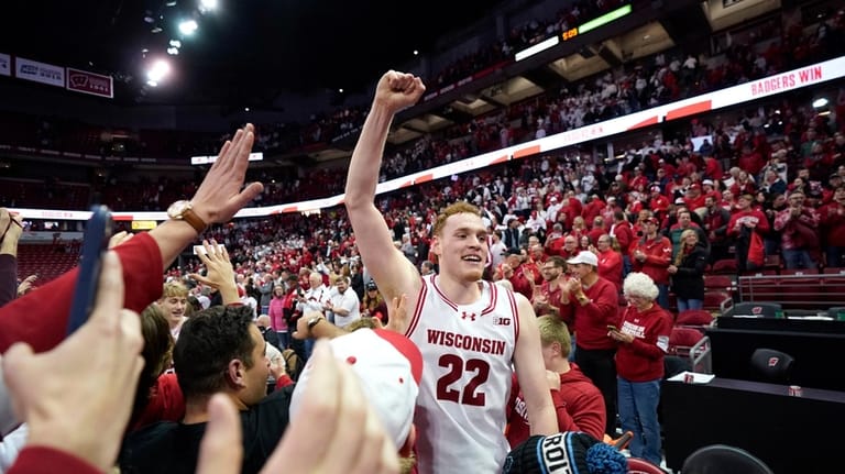 Wisconsin forward Austin Rapp (22) reacts after winning over Michigan...