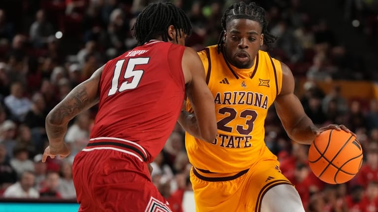 Arizona State forward Allen Mukeba (23) drives on Texas Tech...