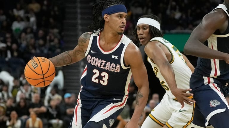 Gonzaga guard Adam Miller (23) drives to the basket against...