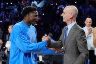 USA Stars guard Anthony Edwards, left, shakes hands with commissioner Adam Silver after the...