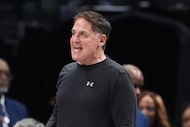 Dallas Mavericks owner Mark Cuban shouts in the direction of an official in the second half...