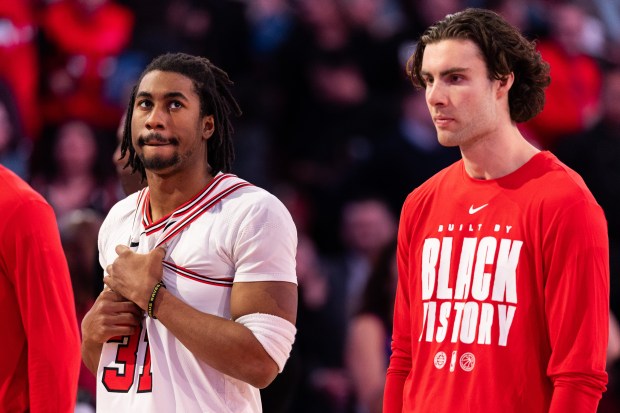 Chicago Bulls guard Jaden Ivey (31) and guard Josh Giddey stand for the national anthem ahead of a game against the Toronto Raptors at the United Center in Chicago on Feb. 19, 2026. (Josh Boland/Chicago Tribune)