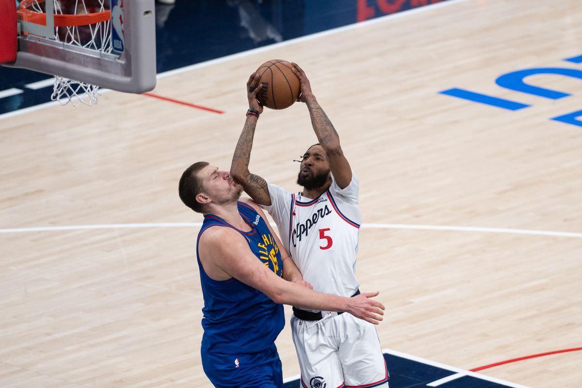 Los Angeles Clippers forward Derrick Jones Jr (5) shoots over Nikola Jokic (15) of the Denver Nuggets during a game between the Los Angeles Clippers and the Denver Nuggets on Thursday, February 19,2026 at Intuit Dome in Inglewood Calif