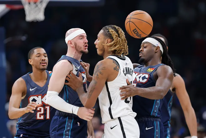 Feb 20, 2026; Oklahoma City, Oklahoma, USA; Oklahoma City Thunder guard Alex Caruso (9) and Brooklyn Nets forward/center Noah Clowney (21) get into an argument during the second half at Paycom Center. Mandatory Credit: Alonzo Adams-Imagn Images