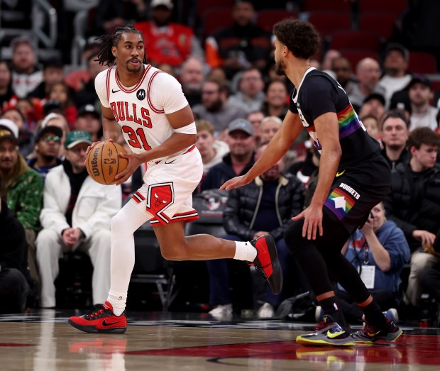 Chicago Bulls guard Jaden Ivey (31) looks for an open teammate in the first half of a game against the Denver Nuggets at the United Center in Chicago on Feb. 7, 2026. (Chris Sweda/Chicago Tribune)